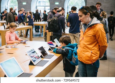 Berlin, October 2, 2017: Presentation Of The New Advanced Tablet Ipad Pro In The Official Apple Store. Young Buyers Came With Their Parents To See New Gadgets.