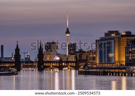 Berlin with the river Spree at dusk with the Oberbaum Bridge and the famous Television Tower