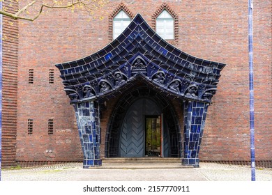 Berlin Schmargendorf, 2022: Entrance to the Evangelical Church of the Holy Cross (Kreuzkirche), one of the rare expressionist sacred buildings. View of the portal porch with blue glazed ceramics.