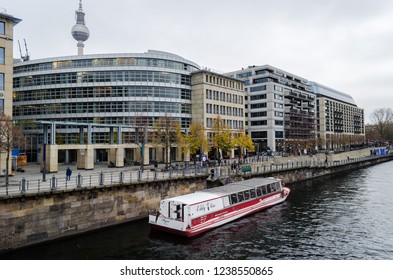 Berlin, September 2017: Views of Spree river and its surrounding buildings, with the occasional tourist tour boats going through 