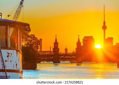 Berlin skyline during sunset with a view of the Oberbaum Bridge and the TV Tower - Powered by Shutterstock