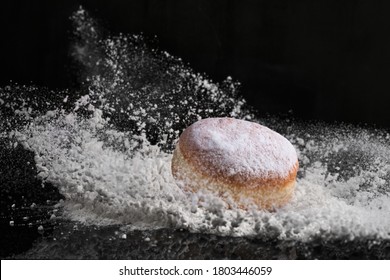 Berliner Donut With Jam Stuffed Falls Into Flour.