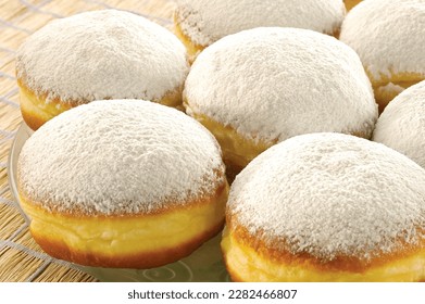 Berliner Pfannkuchen, a German donut, traditional yeast dough deep fried filled with chocolate cream and sprinkled with powdered sugar, sweetness.
Berliner donuts
 - Powered by Shutterstock