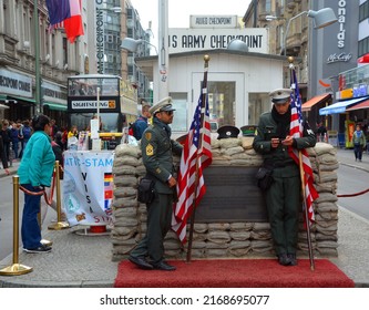 BERLIN-GERMANY 08 23 17: Unidentified Young Men Dressed As American Soldiers Stand In Front The Check Point Charlie Remembering The Cold War