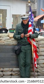 BERLIN-GERMANY 08 23 17: Unidentified Young Men Dressed As American Soldiers Stand In Front The Check Point Charlie Remembering The Cold War