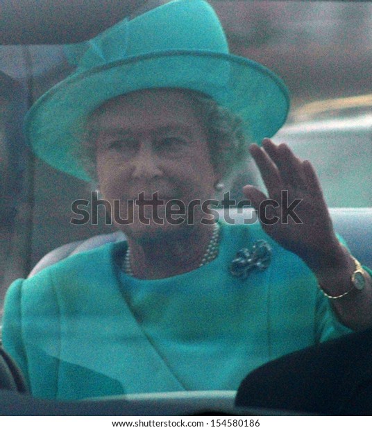 BERLIN-NOVEMBER\
2, 2004: Queen Elizabeth II (Elizabeth Alexandra Mary Windsor) in\
her car during a state visit in\
Germany.