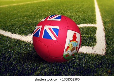 Bermuda flag on ball at corner kick position, soccer field background. National football theme on green grass. - Powered by Shutterstock