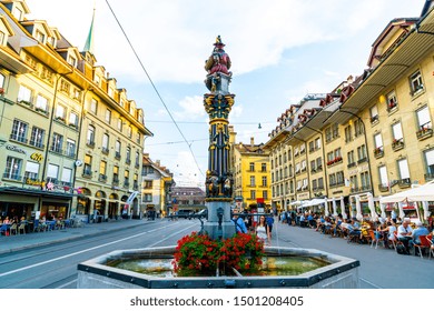 Bern, Switzerland - 23 AUG 2018: People On The Shopping Alley With The Zytglogge Astronomical Clock Tower Of Bern In Switzerland.