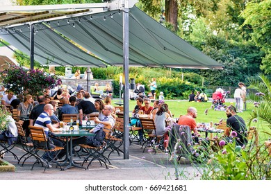 Bern, Switzerland - August 31, 2016: People Relaxing At Open Air Cafe In Old City Center Of Bern, Bern-Mittelland, Switzerland