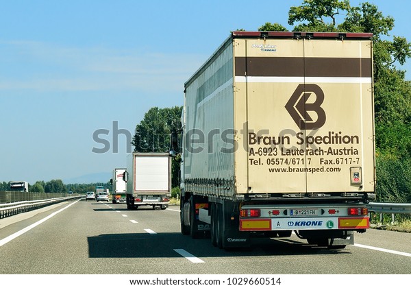 Bern, Switzerland - August 31, 2016: Trucks\
on the roadway,\
Switzerland