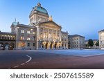 Bern, Switzerland with the Federal Palace of Switzerland at blue hour. ("Curia Confoederationis Helveticae" translates to "The Parliament Building of Switzerland")