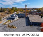 Bernat Mill aerial view in fall with fall foliage at 19 Depot Street in historic town center of Uxbridge, Massachusetts MA, USA. 