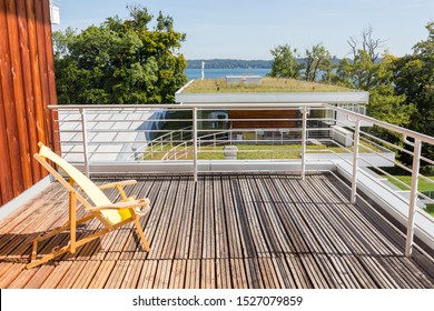 BERNRIED, BAVARIA / GERMANY - September 20, 2019: View from a balcony with deck chair towards lake Starnberg. Part of "Buchheim Museum of Phantasy" - famous for its expressionist collection.