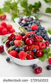 Berries Closeup Assorted Mix Of Strawberry, Blueberry, Raspberry And Sweet Cherry On A White Table. 