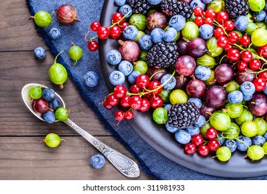 Berries fruits background. Antioxidants, detox diet, organic fruits background. - Shutterstock ID 311981933