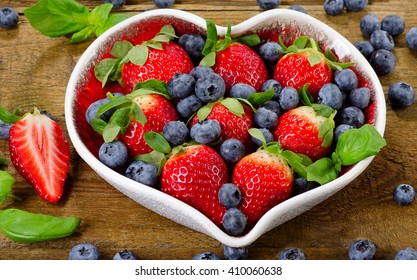 Berries In Heart Shaped Bowl. Healthy Diet Eating Concept. 