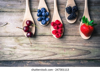 Berries on wooden rustic background