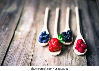 Berries on wooden rustic background