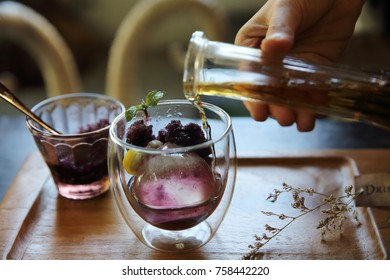 Berries Tea With Ice Ball On Wood Background