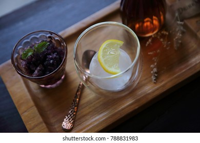 Berries Tea With Ice Ball On Wood Background