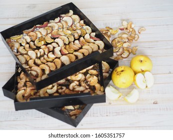  Berry Apple Fruit Chips. Sliced Apples Are Dried On A Metal Wire Rack From A Home Dryer. Wooden White Rustic Table.