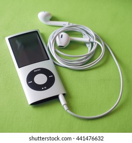 BERRY, AUSTRALIA - June 23 2016 : An Apple  iPod Nano 4th generation, in silver,  with Apple Earpods attached.