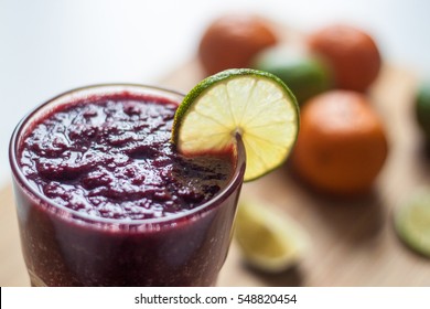 Berry Dark Purple Smoothie With Lime And Tangerine