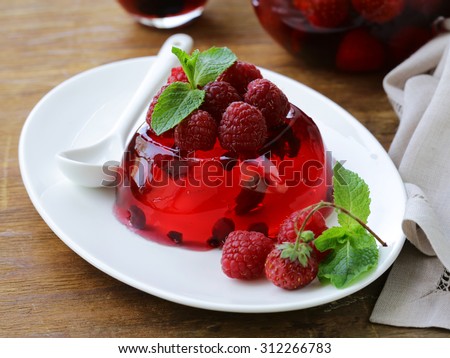 berry fruit jelly with fresh berries - summer dessert