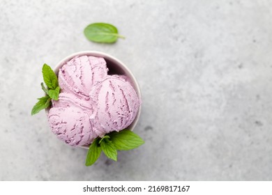 Berry ice cream sundae in bowl. Top view flat lay with copy space