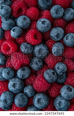 Berry mix of blueberries and raspberries. Fresh, ripe, juicy berry. Macro selective focus.