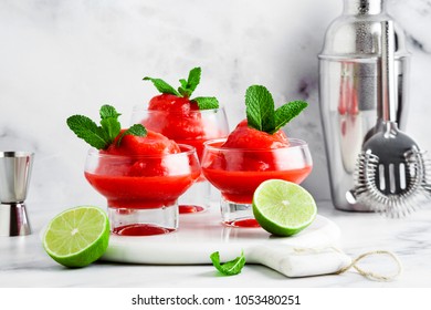 Berry Slushie With Lime, Summer Refreshing Drink In Serving Glasses. Bartender Tools In The Background