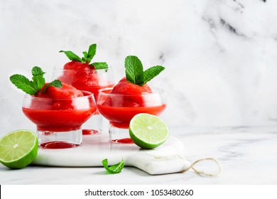 Berry Slushie With Lime, Summer Refreshing Drink In Serving Glasses. 