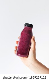 Berry Smoothie In A Bottle In The Hand Of A Woman. Detox, Healthy Eating. Copy Space.