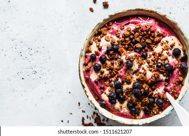 Berry Smoothie Bowl With Peanut Butter And Granola, Top View.