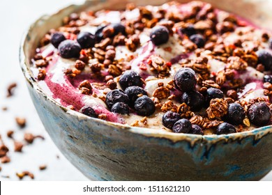 Berry Smoothie Bowl With Peanut Butter And Granola.