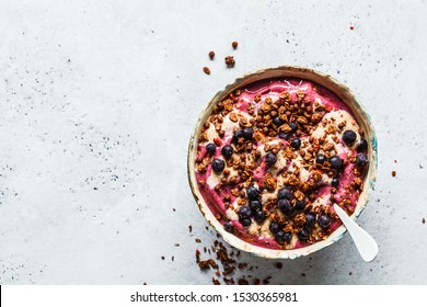 Berry Smoothie Bowl With Peanut Butter And Granola, Top View.