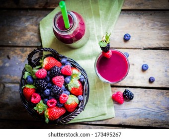 Berry smoothie on rustic wooden background - Powered by Shutterstock