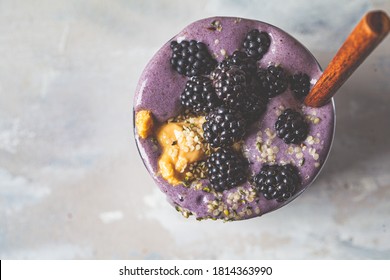 Berry Smoothie With Peanut Butter And Hemp Seeds In A Glass. Healthy Vegan Food Concept.