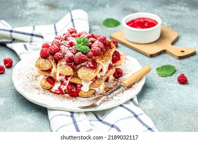 Berry Tiramisu With Biscuit With Coffee Cream And Fresh Berries. Tiramisu With Raspberry On A Light Background,