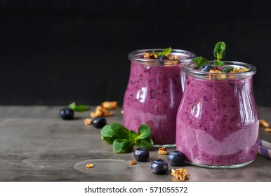 Berry Yogurt With Bran And Oatmeal On A Metal Background