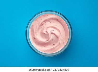 Berry yogurt on blue background, top view - Powered by Shutterstock