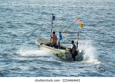 Beruwala Sri Lanka - 09 27 2022
Motor Boat Launching To The Sea From The Fishing Harbor Beruwala. Fast Fishing Boat Racing To The Ocean. Color Collector