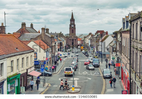 Berwick-upon-Tweed,\
England - April 2018: High Street in town center of\
Berwick-upon-Tweed, northernmost town in Northumberland at the\
mouth of River Tweed in England,\
UK