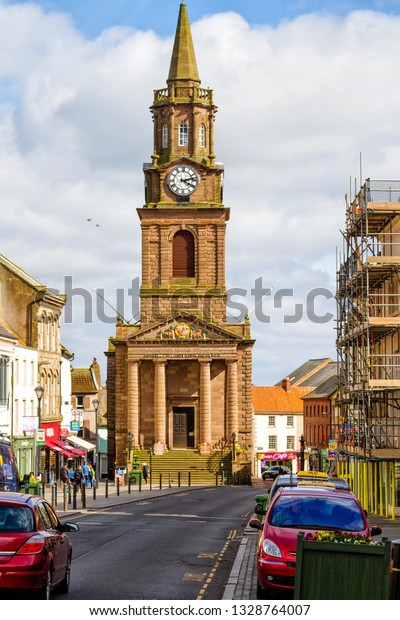 BERWICK-UPON-TWEED,\
ENGLAND - APRIL 3, 2018: High Street in town center of\
Berwick-upon-Tweed, northernmost town in Northumberland at the\
mouth of River Tweed in England,\
UK