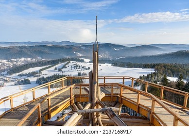 Beskid mountain winter landscape seen from the wooden path of the treetop observation tower at Slotwiny Arena ski station in Krynica Zdroj, Poland