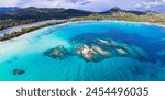 Best beaches of Corsica island - aerial view of beautiful Santa Giulia long beach with sault lake from one side and turquoise sea from other

