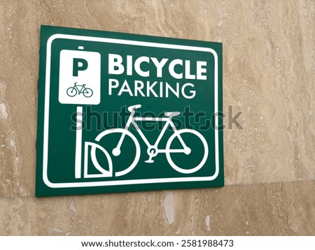 The best bicycle parking sign on wall. Designation of area for securing personal bicycle by front wheel for safe parking on street. Equipped parking area for bicycles