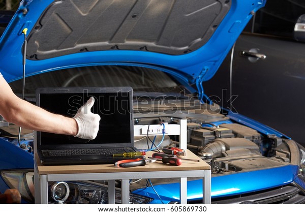 Best car garage service. Table with tools for\
vehicle maintenance