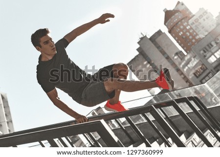 Similar – Image, Stock Photo Young man stretching in the city after jogging