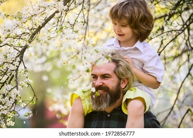 Best Dad Ever. Child Having Fun With Dad. Happy Family. Little Boy And Father In Nature Background. Springtime. Hipster Piggybacking Baby. Bearded Brutal Man Good Father. Fathers Day. Dad And Son